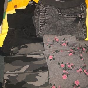 Four pairs of pants two pair or extra large tights and two pairs of large